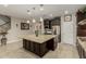 Kitchen island and breakfast bar offering granite countertops, stainless steel appliances, and ample counter space at 9747 W Sands Dr, Peoria, AZ 85383