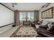 Relax in this living room featuring comfortable leather seating and a projector with a screen at 9747 W Sands Dr, Peoria, AZ 85383