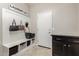 Mud room area with storage, bench seating, and coat hooks at 9747 W Sands Dr, Peoria, AZ 85383