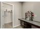 Office nook with a built-in desk, decorative art, and access to a walk-in closet at 9747 W Sands Dr, Peoria, AZ 85383