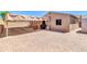 This backyard includes a covered patio with a grill and an outdoor dining area at 1018 S Toltec --, Mesa, AZ 85204