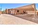 Inviting backyard featuring a covered patio, brick-paved area, and outdoor seating, perfect for relaxing at 1018 S Toltec --, Mesa, AZ 85204