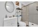 Bright bathroom featuring a shower with sliding doors, a vanity with sink, and modern fixtures at 1018 S Toltec --, Mesa, AZ 85204