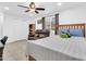 A bedroom with tile flooring, a leather couch, and a wooden bed frame, offering a comfortable living space at 1018 S Toltec --, Mesa, AZ 85204