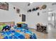 Bright bedroom with twin bed, playful decor, tiled floors and ample closet space offering a welcoming atmosphere at 1018 S Toltec --, Mesa, AZ 85204
