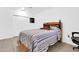 A bedroom with tiled floors, a wooden bed frame, and a closet, offering a comfortable space at 1018 S Toltec --, Mesa, AZ 85204