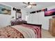 Spacious bedroom features a ceiling fan and large closet for ample storage at 1018 S Toltec --, Mesa, AZ 85204