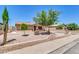 Charming single-story home boasts mature trees, a manicured lawn, and curb appeal at 1018 S Toltec --, Mesa, AZ 85204