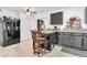 A kitchen featuring black cabinets and a center island with stools, perfect for casual dining and entertaining at 1018 S Toltec --, Mesa, AZ 85204