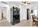 Kitchen featuring a large refrigerator, white walls, tile flooring, and a ceiling fan at 1018 S Toltec --, Mesa, AZ 85204