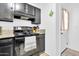 Kitchen featuring black appliances, modern cabinets, granite countertops and tiled floors at 1018 S Toltec --, Mesa, AZ 85204