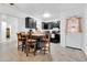 Well-lit kitchen featuring dark cabinetry, granite countertops, and stainless steel appliances creating a modern cooking space at 1018 S Toltec --, Mesa, AZ 85204