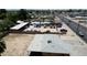 Property aerial view showcasing the lot, street, and nearby homes at 1039 E Broadway Rd, Mesa, AZ 85204