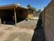 Exterior view showcasing the covered patio and the potential for outdoor entertaining at 1039 E Broadway Rd, Mesa, AZ 85204
