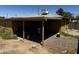 Back exterior view showcasing the covered patio, perfect for outdoor relaxation at 1039 E Broadway Rd, Mesa, AZ 85204