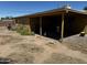 View of the backyard with a covered patio area attached to the house at 1039 E Broadway Rd, Mesa, AZ 85204