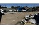 Exterior view showing vehicles and debris at 1039 E Broadway Rd, Mesa, AZ 85204