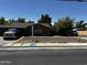 Exterior view of home featuring a well-maintained lawn at 1039 E Broadway Rd, Mesa, AZ 85204