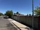 View of property with tall block wall at 1039 E Broadway Rd, Mesa, AZ 85204