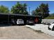 View of garage area with multiple cars being repaired at 1039 E Broadway Rd, Mesa, AZ 85204