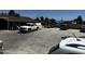 View of parking lot with white pickup and other vehicles at 1039 E Broadway Rd, Mesa, AZ 85204