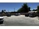 Spacious parking lot with multiple vehicles, providing ample parking space for residents and visitors at 1039 E Broadway Rd, Mesa, AZ 85204