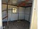 Interior view of the shed, offering ample storage space with a window at 1039 E Broadway Rd, Mesa, AZ 85204