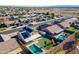 Aerial view of a home in a residential neighborhood featuring a pool and backyard play area at 10822 W Quail Ave, Peoria, AZ 85373