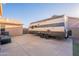 Large RV parked on a concrete pad in a well-maintained backyard space at 10822 W Quail Ave, Peoria, AZ 85373