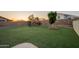 Fenced backyard featuring a playground and artificial turf, perfect for outdoor activities at 10822 W Quail Ave, Peoria, AZ 85373