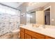 Bathroom featuring fish themed shower curtain, white vanity and framed mirror at 10822 W Quail Ave, Peoria, AZ 85373