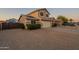 Inviting two-story home featuring desert landscaping, solar panels, and a spacious driveway at 10822 W Quail Ave, Peoria, AZ 85373