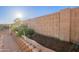 Vegetable garden with fresh produce, rich soil, and a sprinkler system at 10822 W Quail Ave, Peoria, AZ 85373