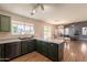 Kitchen island and stainless steel dishwasher overlooks the living area, perfect for entertaining at 10822 W Quail Ave, Peoria, AZ 85373
