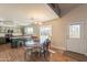View of the eat-in kitchen offering wood look floors and outdoor access to the backyard at 10822 W Quail Ave, Peoria, AZ 85373