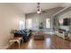 Well-lit living room with hardwood floors, comfortable furniture, and stylish decor at 10822 W Quail Ave, Peoria, AZ 85373