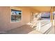 The covered patio offers an open view and a screened door for easy access at 10822 W Quail Ave, Peoria, AZ 85373