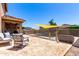 Backyard patio with furniture, a safety fence and a view of the pool at 13123 W Cottontail Ln, Peoria, AZ 85383