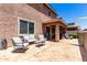Backyard patio with furniture, a grill, and access to the yard at 13123 W Cottontail Ln, Peoria, AZ 85383