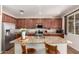 Modern kitchen boasts granite countertops, stainless steel appliances, and ample cabinet space, perfect for cooking and entertaining at 13123 W Cottontail Ln, Peoria, AZ 85383