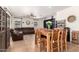 Inviting living room featuring a comfortable sectional sofa, large windows, and stylish decor creating a cozy atmosphere at 13123 W Cottontail Ln, Peoria, AZ 85383