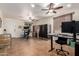 Spacious home office with multiple workstations, ample storage, and tile flooring ideal for a productive work environment at 13123 W Cottontail Ln, Peoria, AZ 85383