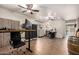 Well-lit home office featuring multiple work areas, including built-in storage and plenty of room for creative projects at 13123 W Cottontail Ln, Peoria, AZ 85383