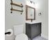 Powder room featuring updated vanity, designer mirror, and tile flooring at 1350 S Greenfield Rd # 1166, Mesa, AZ 85206