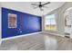Spacious bedroom with wood floors, bright windows, and a bathroom vanity in the corner at 1350 S Greenfield Rd # 1166, Mesa, AZ 85206