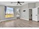 Spacious bedroom with a large window, laminate flooring and neutral paint at 1350 S Greenfield Rd # 1166, Mesa, AZ 85206