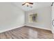 Bedroom featuring luxury vinyl plank floors, a ceiling fan, and a bright window at 1350 S Greenfield Rd # 1166, Mesa, AZ 85206