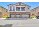 Three-story multi-Gathering home with a three-car garage and a balcony on the second floor at 1350 S Greenfield Rd # 1166, Mesa, AZ 85206
