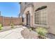 Charming home featuring a welcoming front entrance, a well-maintained landscape, and a beautiful arched window at 1350 S Greenfield Rd # 1166, Mesa, AZ 85206