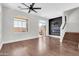 Bright living room with wood floors, ceiling fan, fireplace, and glass patio doors at 1350 S Greenfield Rd # 1166, Mesa, AZ 85206